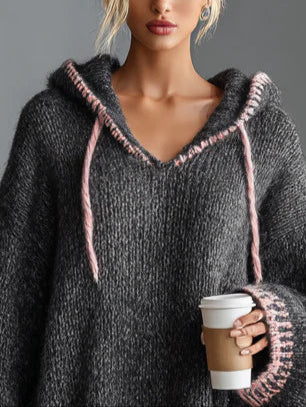 Loose-fitting hooded pink-trimmed knitted dress